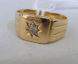 An 18ct gold signet ring, set with a diamond