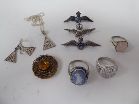 Items of personal ornament: to include two silver coloured metal RAF wings brooches
