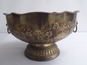 A Georgian style silver plated on copper, pedestal punch bowl with opposing lion mask and ring