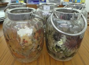 A set of five modern floral printed, glass jars with swing handles  10"h