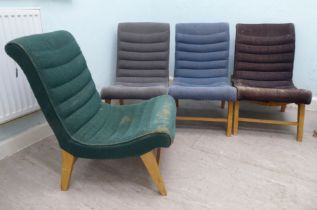 Four mid 20thC fabric covered chairs, raised on beech legs