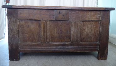 An early 18thC oak coffer with straight sides and a hinged lid, on block feet  22"h  42"w