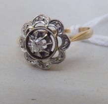 An 18ct gold petal design ring