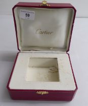 A hinged Cartier watch box