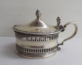 A George III silver mustard pot with a hinged lid  London 1813