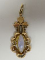 A yellow metal pendant, set with a central opal, featuring a floral motif  stamped 9ct