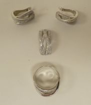 Silver and cubic zirconia jewellery, viz. a ring, a pair of clip-on earrings and a scarf clip