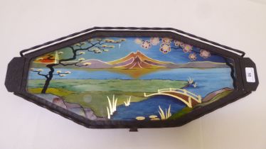 An Arts & Crafts inspired patinated metal tray, the centre set with a reverse painted glass panel,