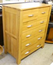 A modern light oak six drawer dressing chest, raised on block feet  40"h  33"w