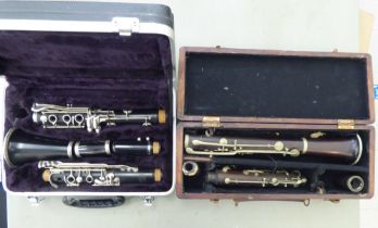 A La Fleur & Son clarinet, in a compartmented wooden case; and a similar, J Michael Japanese