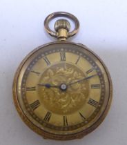 A yellow metal watch, faced by a Roman dial  stamped 18k