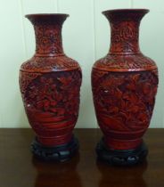 A pair of Chinese cinnabar vases, each decorated with peonies  10"h