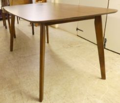 A modern mahogany effect table with curved ends, raised on tapered legs  29"h  59"w  36"deep