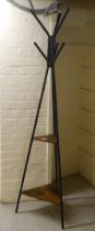 A modern metal framed hat/coat stand of triangular form  72"h