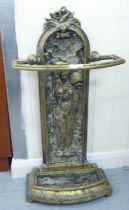 A Victorian style cast brass stickstand, decorated with a female figure  "h