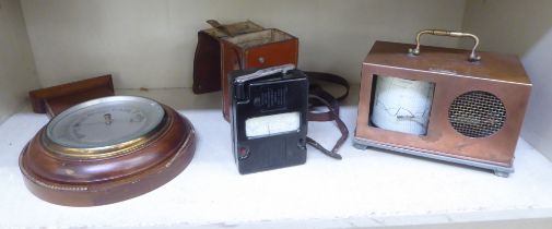 Scientific measuring equipment, viz. an ohmmeter; a barograph; and a barometer