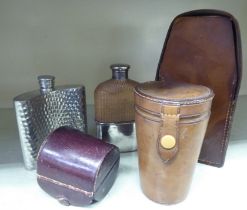 Five items of huntsman's accoutrements: to include a cut glass flask with a silver plated cup, in
