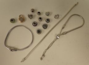 A silver Pandora bracelet; and associated charms