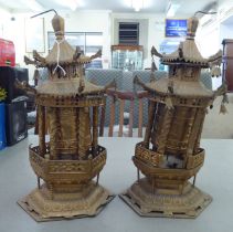 A pair of cast metal prayer wheels, fashioned as pagodas  15"h