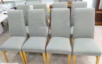 A set of eight modern fabric covered dining chairs, raised on beech legs