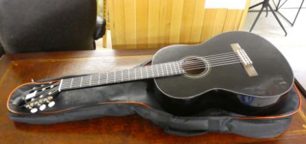 A Yamaha C40 acoustic guitar, in a soft carrying case