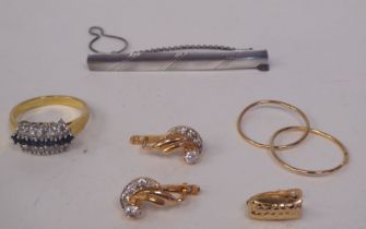 Items of personal ornament: to include a pair of 14ct gold hoop earrings; and a silver tie-clip