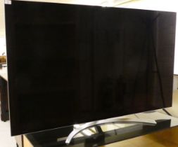 An LG 65" television, on a dedicated stand  (no cables or remote control)