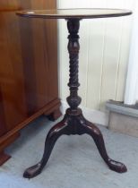 A George III mahogany pedestal table, raised on a spiraltwist column and a tripod base  26"h  16"w