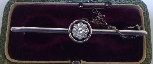 A floral design diamond set, bi-coloured metal brooch  boxed