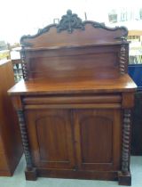 A late Victorian mahogany chiffonier with a raised back, over a drawer and two panelled doors, on