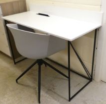 A modern desk, the white painted top raised on a tubular metal underframe  34"h  48"w; and a