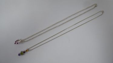 Two variously set silver and coloured stone set pendants, on fine neckchains and ring bolt clasps