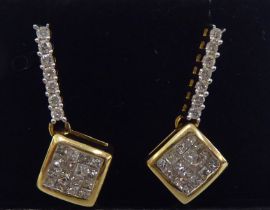 A pair of yellow metal pendant earrings, set with diamonds