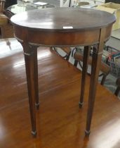 A late 19thC crossbanded and parquetry mahogany oval table, raised on square, tapered legs and spade