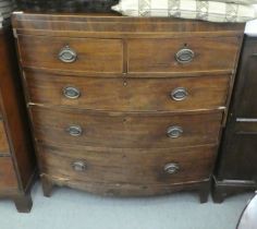 A mid 19thC mahogany two part bow front dressing chest with two short/three graduated long drawers