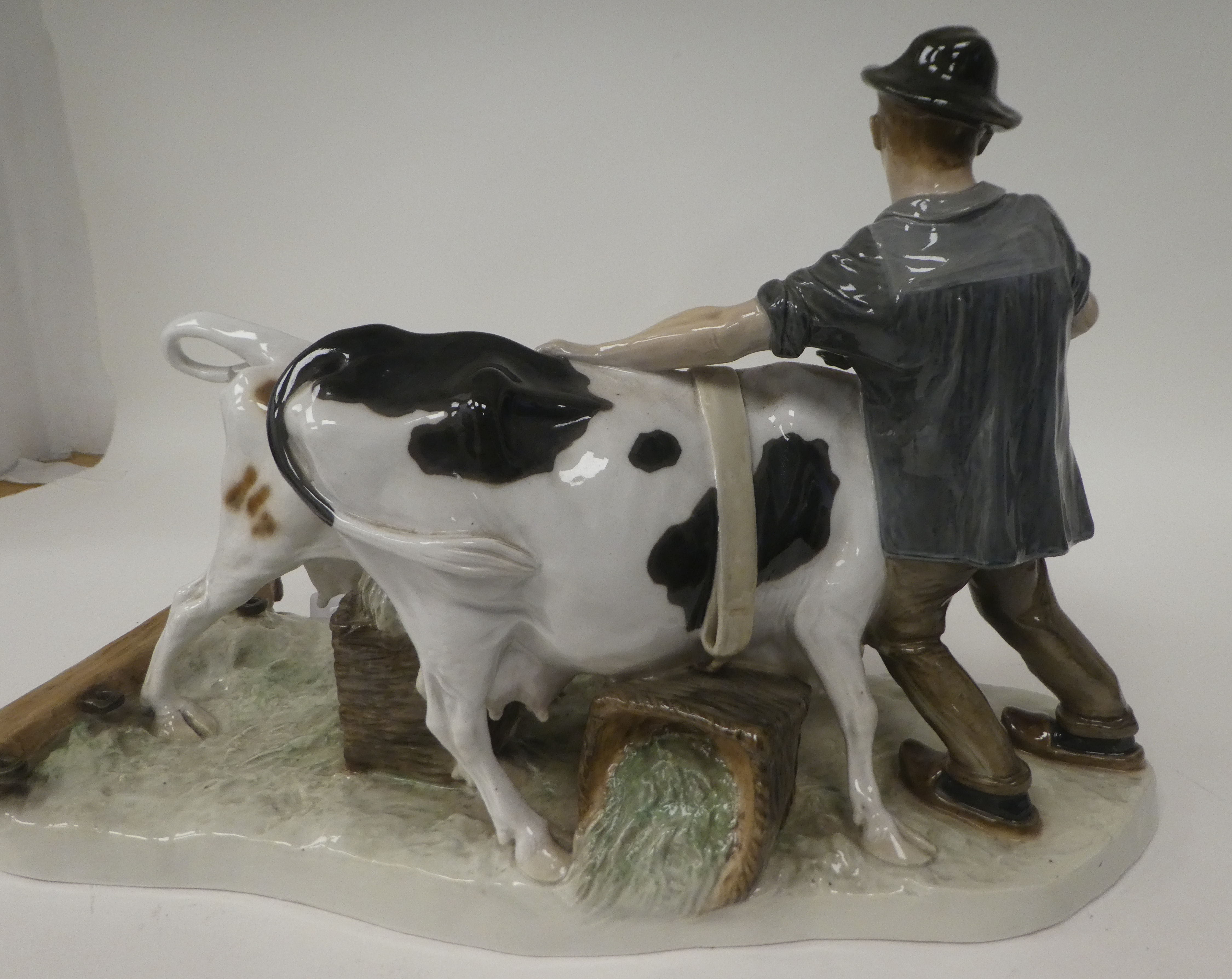 A 1920/1930s Meissen porcelain group, a man wearing rustic clothes, grappling with two wilful - Image 4 of 5