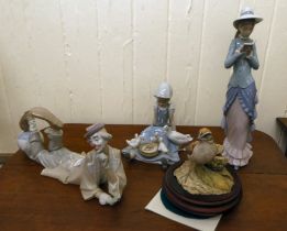 Three Lladro porcelain figures: to include a clown  6"h; and a Kaiser porcelain bird  5"h