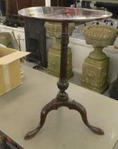A late 19thC mahogany pedestal table, raised on a fluted column and carved tripod base  28"h  18.5"