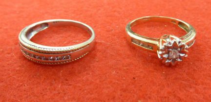 A 9ct gold and diamond set half eternity ring; and another, solitaire with diamond shoulders