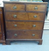 A 19thC oak dressing chest with two short/three graduated long drawers and brass bail handles,