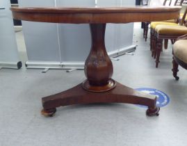 A William IV mahogany tip-top breakfast table, over an octagonal, vase shape column and an