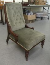 An Edwardian mahogany showwood framed nursing chair, later part button upholstered in green