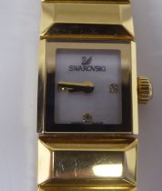 A lady's Swarovski Baguette gilded stainless steel cased, quartz bracelet wristwatch  boxed