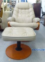 A modern Chair Works recliner chair, cushion upholstered in faux, beige coloured hide, rotating on