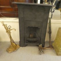 An early 20thC cast iron fire surround and back, decorated in relief with flora  41"h  30"w; and a