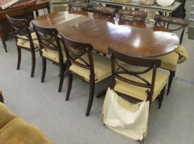 A Regency mahogany twin pedestal dining table  29"h  60"L with one extending leaf; and a