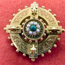 A late Victorian yellow metal brooch, set with coral, seed pearls and jade