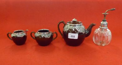 Silver collectables: to include a three piece brown streaky glazed pottery tea set with silver