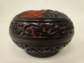 A 19thC cinnabar style bronze and part enamelled cushion shape trinket box and cover, decorated in