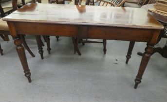 A late 19thC mahogany two drawer side table, raised on turned legs  29"h  49"w